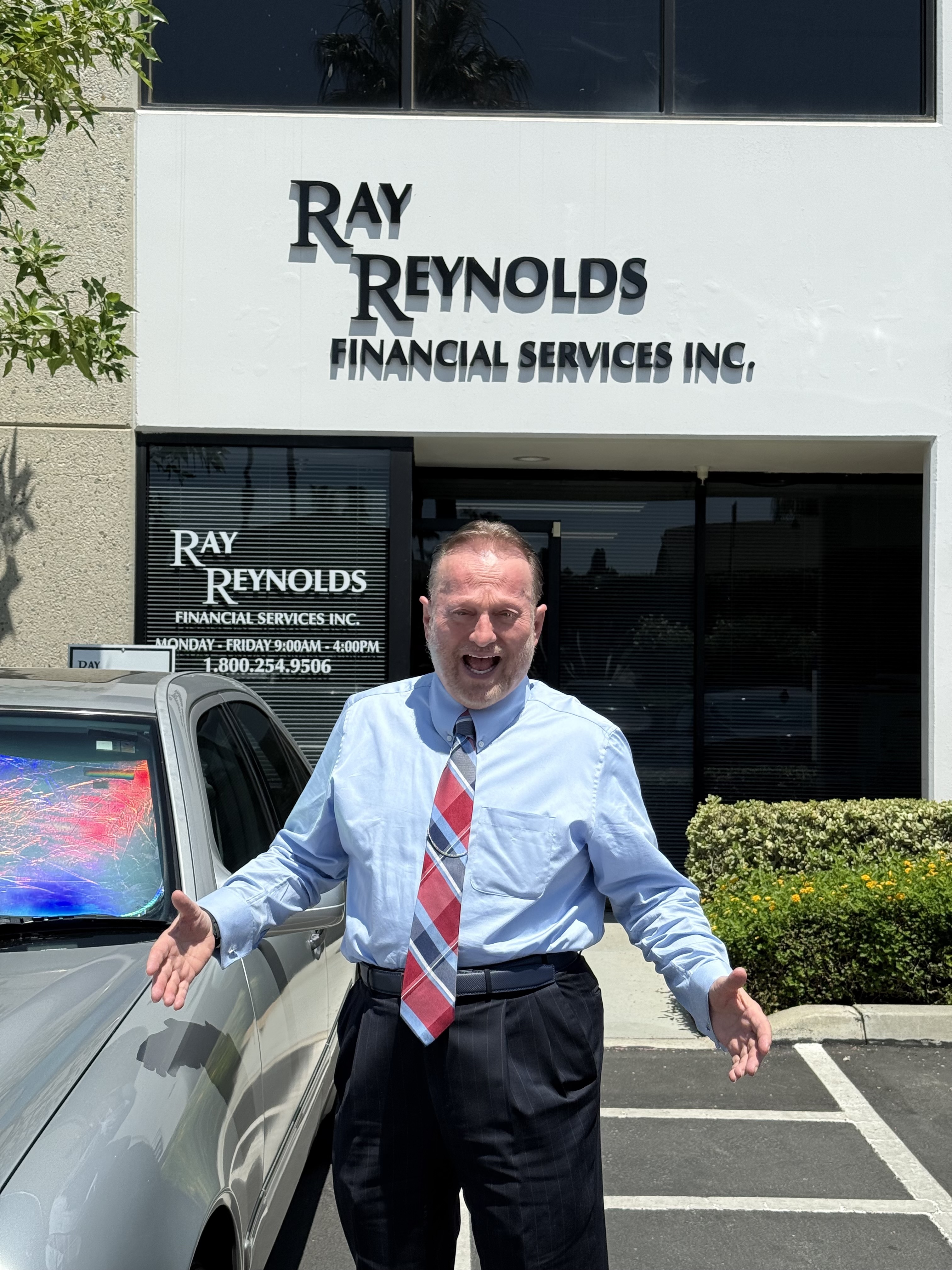 Ray Reynolds outside the Ray Reynolds Financial Services office